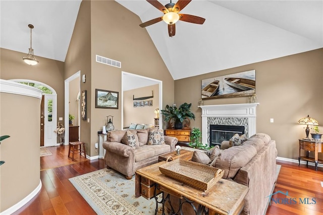14285 Cuckle Creek Rd, Bowling Green, OH 43402 - living room with high vaulted ceiling, ceiling fan, a glass covered fireplace, and wood finished floors