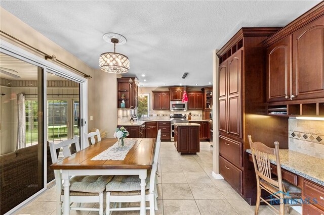 14285 Cuckle Creek Rd, Bowling Green, OH 43402 - dining room with light tile patterned flooring, a chandelier, and recessed lighting