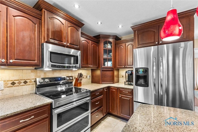 14285 Cuckle Creek Rd, Bowling Green, OH 43402 - kitchen with stainless steel appliances, light stone countertops, glass insert cabinets, tasteful backsplash, and light tile patterned floors