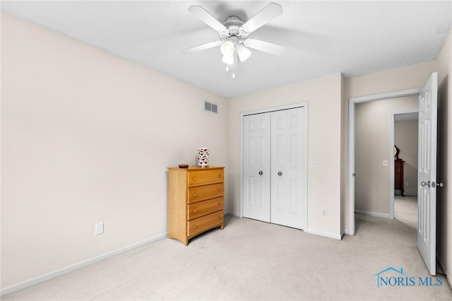 14285 Cuckle Creek Rd, Bowling Green, OH 43402 - bedroom with light carpet, a closet, and a ceiling fan