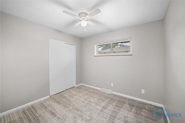 3431 146th St, Toledo, OH 43611 - unfurnished bedroom featuring carpet, a closet, and ceiling fan