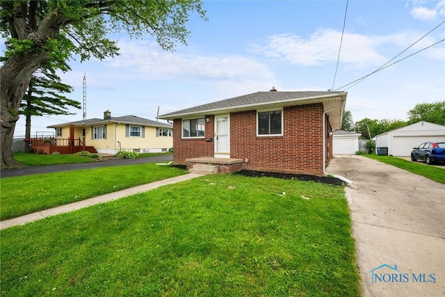 3431 146th St, Toledo, OH 43611 - bungalow-style home featuring brick siding, a front lawn, and a detached garage