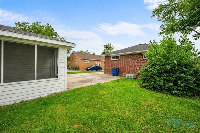 3431 146th St, Toledo, OH 43611 - view of green lawn featuring a sunroom