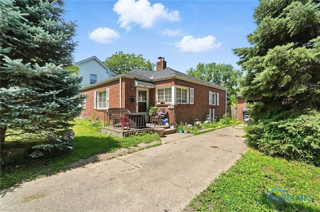 1732 Gilbert Rd, Toledo, OH 43614 - bungalow-style home with brick siding and a chimney