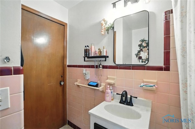1732 Gilbert Rd, Toledo, OH 43614 - bathroom featuring tile walls, vanity, and a wainscoted wall