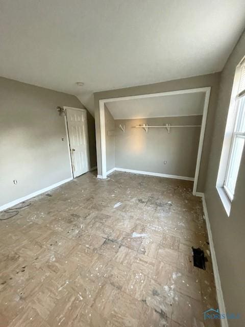 2024 Elliott Ave, Toledo, OH 43606 - unfurnished bedroom with vaulted ceiling and a closet