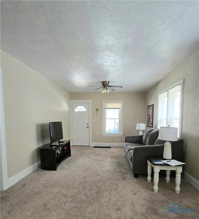 1723 Balkan Pl, Toledo, OH 43613 - carpeted living area with a ceiling fan and a textured ceiling