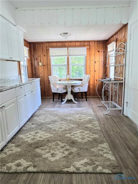 1723 Balkan Pl, Toledo, OH 43613 - dining area featuring wood walls and wood finished floors