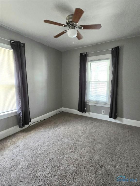 1723 Balkan Pl, Toledo, OH 43613 - spare room featuring carpet and a ceiling fan
