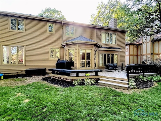 2456 Wembley Ter, Toledo, OH 43617 - rear view of property with an outdoor living space, a lawn, and a chimney