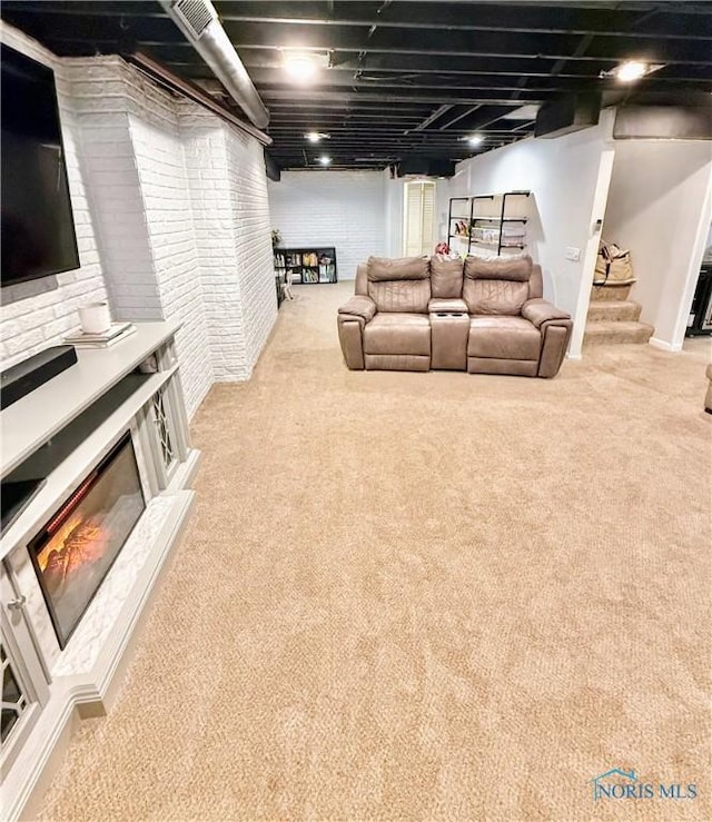 2456 Wembley Ter, Toledo, OH 43617 - living room with carpet, stairs, and brick wall
