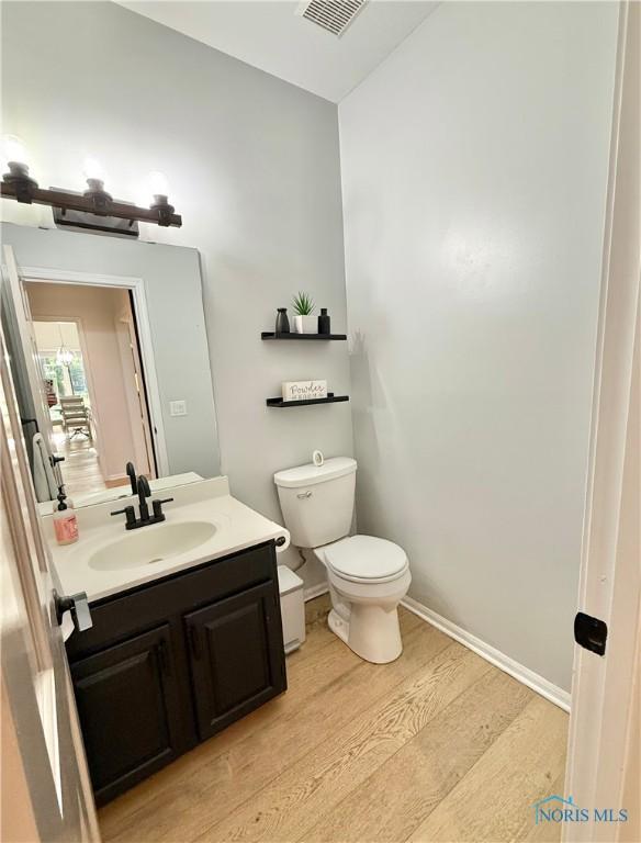 2456 Wembley Ter, Toledo, OH 43617 - bathroom with wood finished floors and vanity