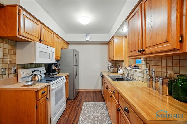 2519 Melva Ct, Toledo, OH 43611 - kitchen featuring stainless steel appliances, butcher block counters, backsplash, and dark wood-style flooring