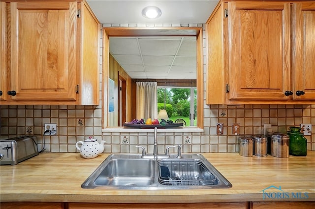 2519 Melva Ct, Toledo, OH 43611 - kitchen featuring butcher block countertops and tasteful backsplash
