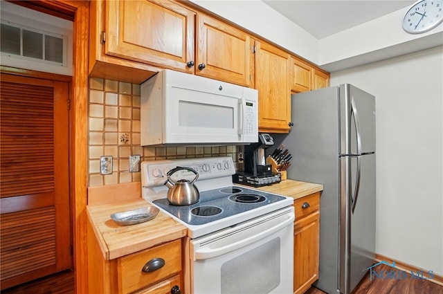 2519 Melva Ct, Toledo, OH 43611 - kitchen featuring white appliances, backsplash, butcher block counters, and dark wood-type flooring