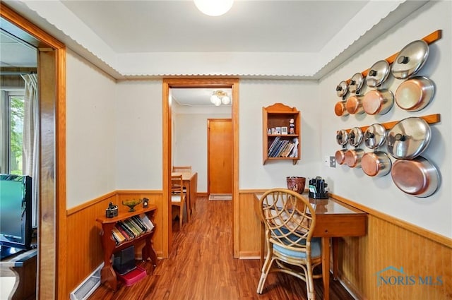 2519 Melva Ct, Toledo, OH 43611 - office featuring wainscoting, wood finished floors, wood walls, and a baseboard radiator