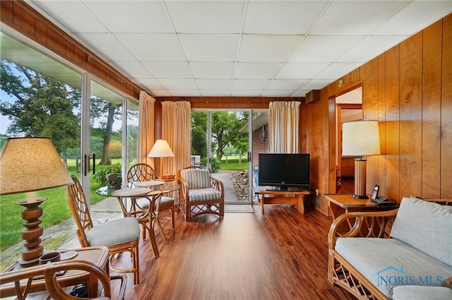 2519 Melva Ct, Toledo, OH 43611 - sunroom / solarium featuring wood finished floors, wood walls, and a drop ceiling