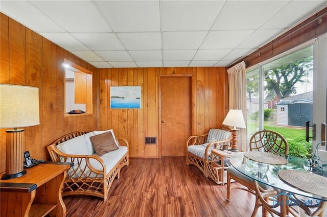 2519 Melva Ct, Toledo, OH 43611 - sitting room with wood finished floors, wooden walls, and a paneled ceiling