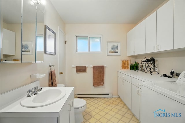 2519 Melva Ct, Toledo, OH 43611 - bathroom with washer / dryer, a baseboard radiator, and vanity
