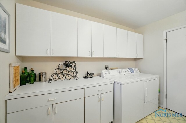 2519 Melva Ct, Toledo, OH 43611 - laundry room with cabinet space and washer and clothes dryer