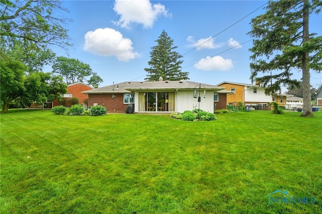 2519 Melva Ct, Toledo, OH 43611 - rear view of property with brick siding
