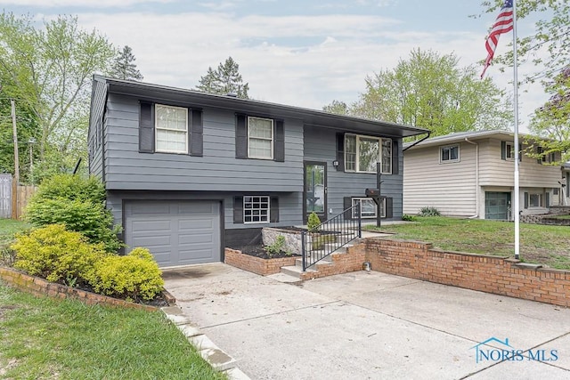 2509 Orchard Hills Blvd, Toledo, OH 43615 - bi-level home with an attached garage and concrete driveway