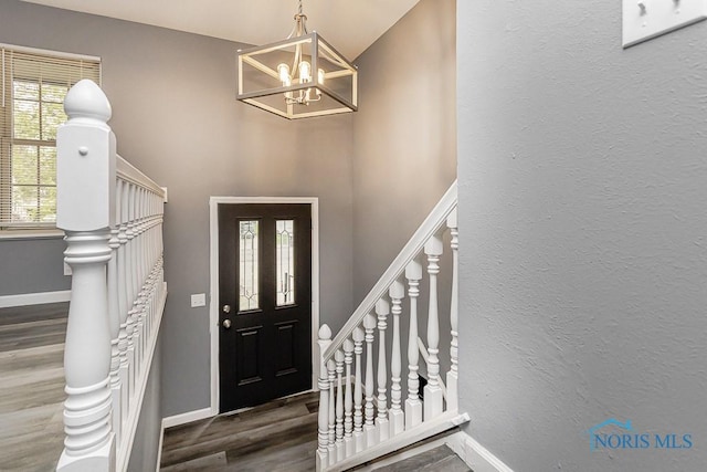 2509 Orchard Hills Blvd, Toledo, OH 43615 - entrance foyer with wood finished floors, a chandelier, stairway, and a high ceiling