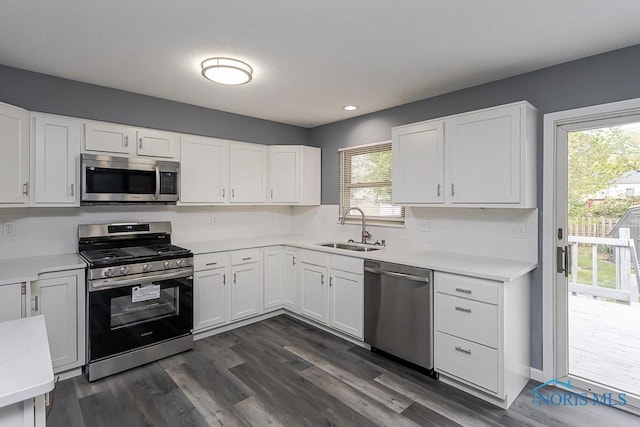 2509 Orchard Hills Blvd, Toledo, OH 43615 - kitchen with appliances with stainless steel finishes, light countertops, white cabinets, and recessed lighting
