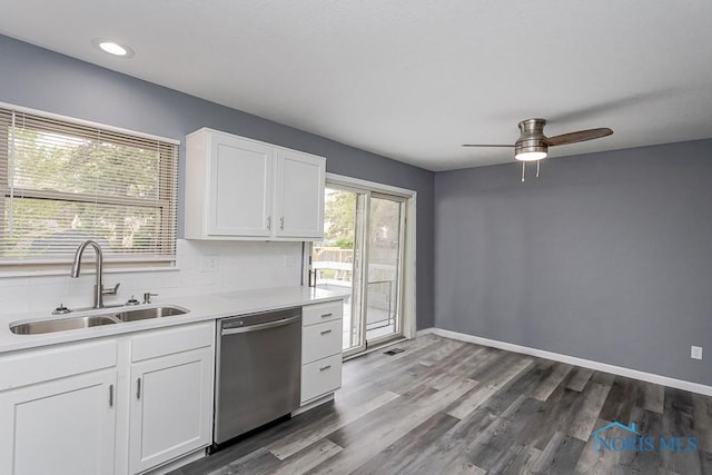 2509 Orchard Hills Blvd, Toledo, OH 43615 - kitchen with dishwasher, white cabinets, light countertops, tasteful backsplash, and a ceiling fan