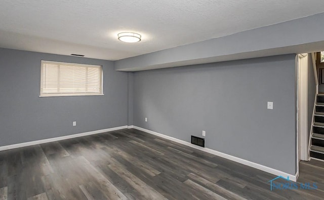 2509 Orchard Hills Blvd, Toledo, OH 43615 - basement with dark wood-style floors and a textured ceiling