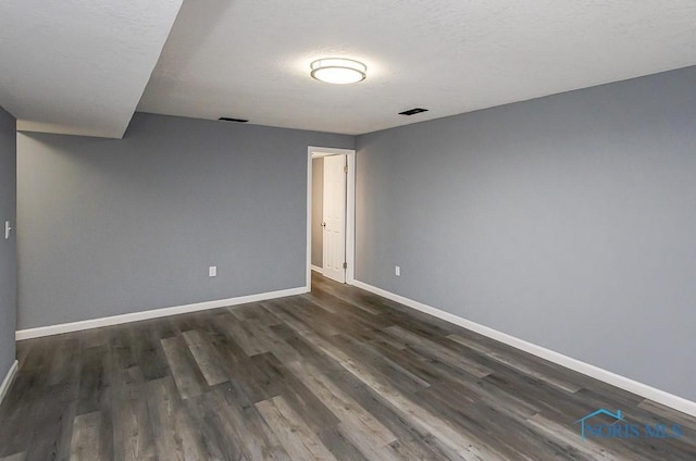 2509 Orchard Hills Blvd, Toledo, OH 43615 - spare room with dark wood-style floors and a textured ceiling