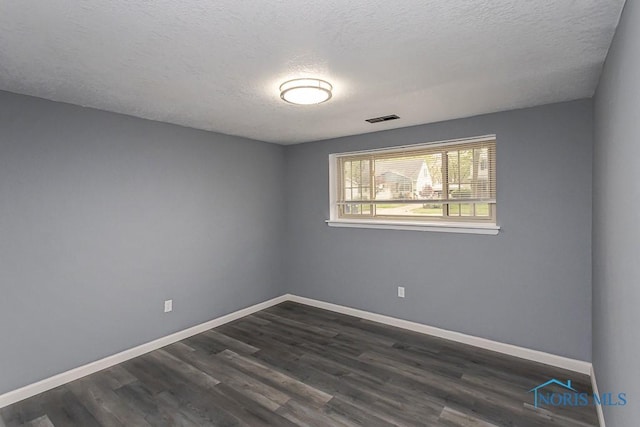 2509 Orchard Hills Blvd, Toledo, OH 43615 - empty room featuring dark wood-style floors and a textured ceiling