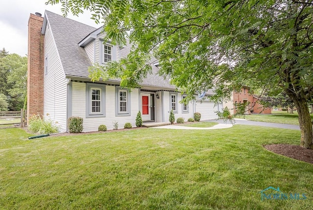 5226 Summer Dr, Sylvania, OH 43560 - cape cod-style house featuring a garage, a front yard, a chimney, and a shingled roof
