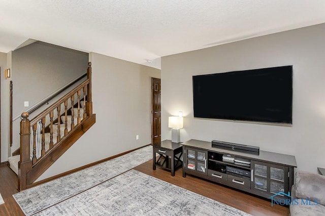 5226 Summer Dr, Sylvania, OH 43560 - living area featuring wood finished floors and stairs