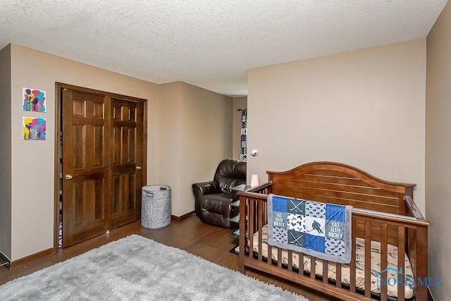 5226 Summer Dr, Sylvania, OH 43560 - bedroom with wood finished floors and a textured ceiling