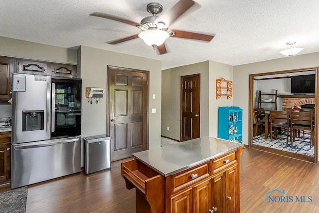 5226 Summer Dr, Sylvania, OH 43560 - kitchen with stainless steel fridge with ice dispenser, dark wood-style floors, ceiling fan, a textured ceiling, and light countertops