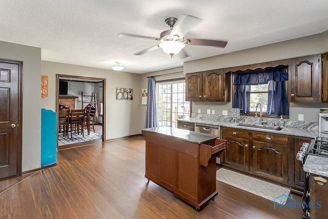5226 Summer Dr, Sylvania, OH 43560 - kitchen with a center island, healthy amount of natural light, and dark wood finished floors