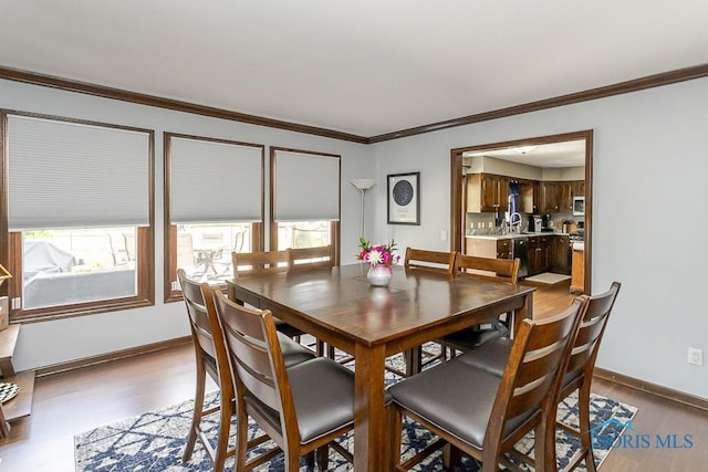5226 Summer Dr, Sylvania, OH 43560 - dining space featuring plenty of natural light, wood finished floors, and ornamental molding