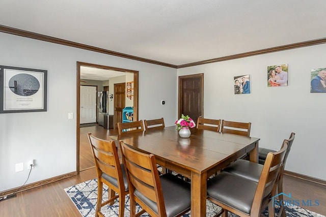 5226 Summer Dr, Sylvania, OH 43560 - dining area featuring wood finished floors and ornamental molding