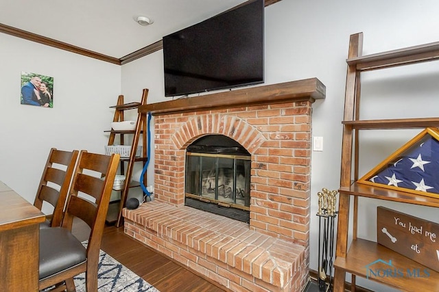 5226 Summer Dr, Sylvania, OH 43560 - living area with wood finished floors, ornamental molding, and a fireplace