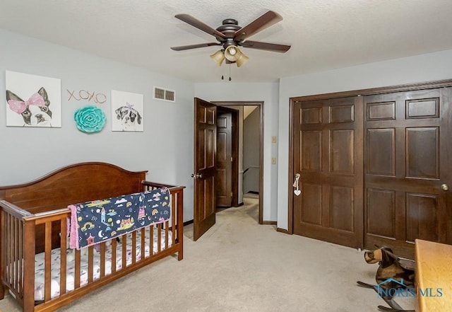 5226 Summer Dr, Sylvania, OH 43560 - bedroom featuring light colored carpet, a ceiling fan, and a crib