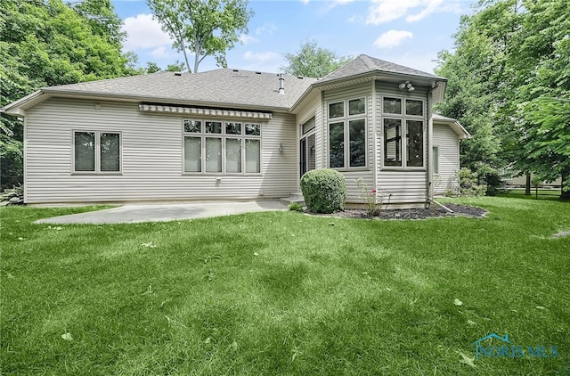 4068 Deer Ravine Ct, Maumee, OH 43537 - back of property with roof with shingles, a patio, and a yard