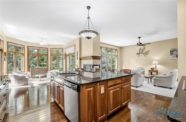 4068 Deer Ravine Ct, Maumee, OH 43537 - kitchen featuring stainless steel dishwasher, a ceiling fan, open floor plan, and dark wood-style floors