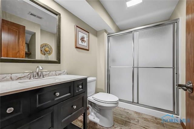 4068 Deer Ravine Ct, Maumee, OH 43537 - full bathroom featuring vanity, a stall shower, and wood finished floors