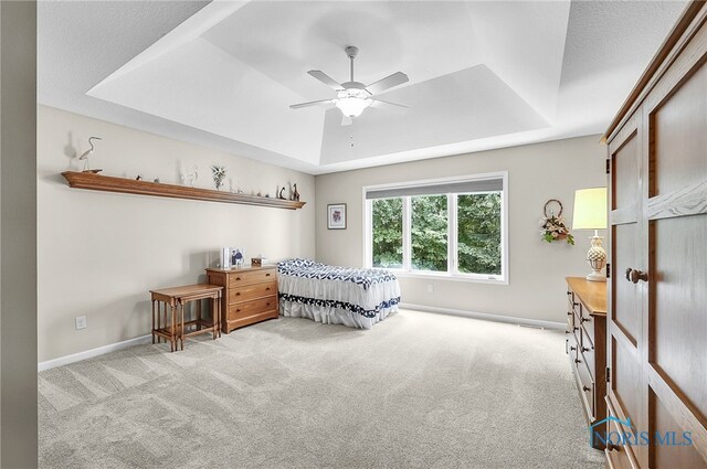 4068 Deer Ravine Ct, Maumee, OH 43537 - bedroom featuring a tray ceiling, carpet flooring, and ceiling fan
