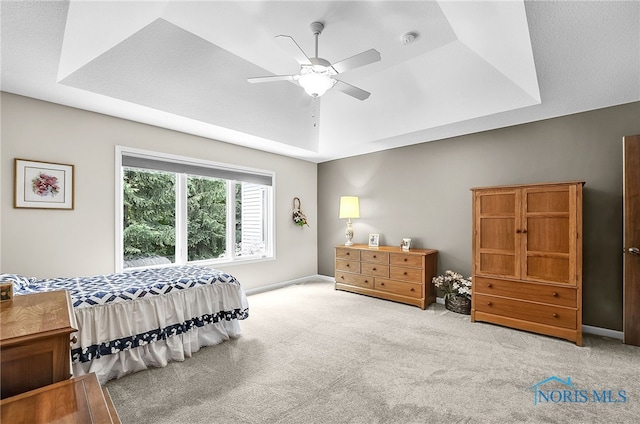 4068 Deer Ravine Ct, Maumee, OH 43537 - carpeted bedroom with a raised ceiling and ceiling fan