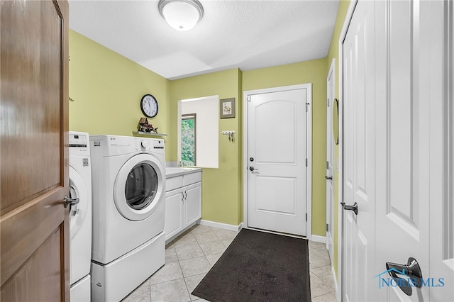 4068 Deer Ravine Ct, Maumee, OH 43537 - laundry room featuring washing machine and clothes dryer, cabinet space, light tile patterned flooring, and a textured ceiling
