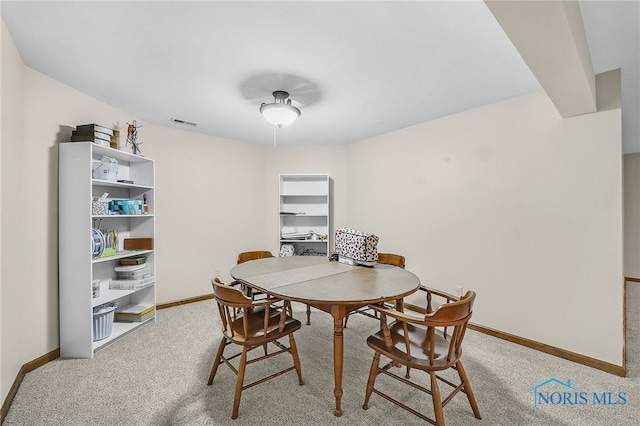 4068 Deer Ravine Ct, Maumee, OH 43537 - dining area featuring baseboards and light carpet