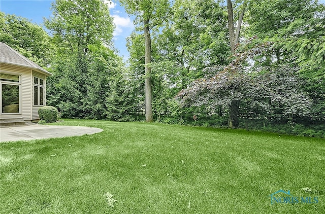 4068 Deer Ravine Ct, Maumee, OH 43537 - view of green lawn featuring entry steps and a patio