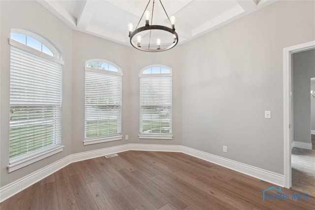 4382 Morgan Pl, Perrysburg, OH 43551 - unfurnished dining area with a chandelier, coffered ceiling, wood finished floors, and beam ceiling